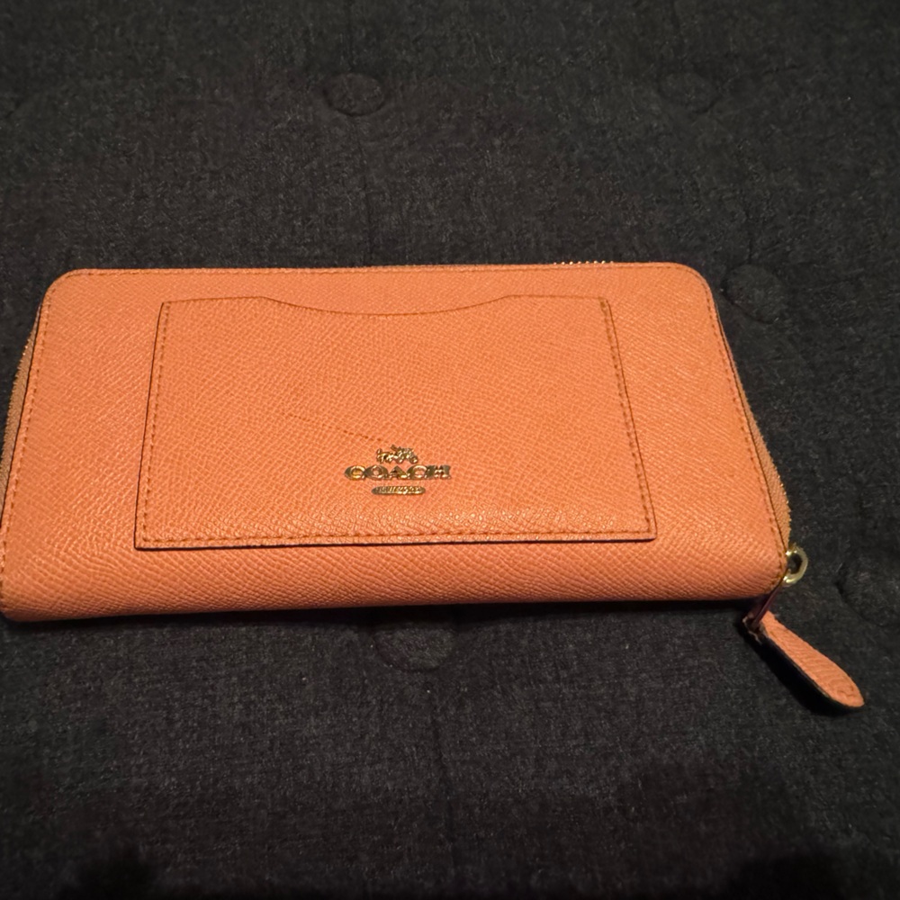 Used pink coach wallet .